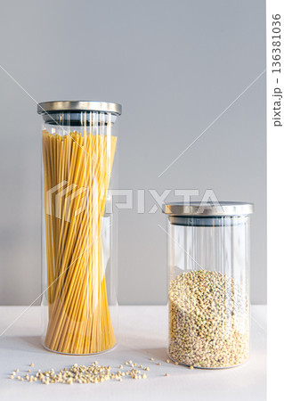 Spaghetti and cereals in glass jars, isolated. 136381036