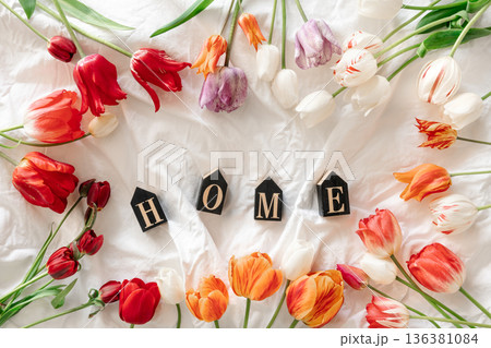 Spring background with flowers tulips and decorative word Home. 136381084