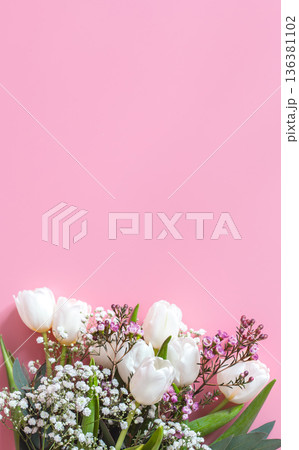 spring flower arrangement on a pink background 136381102