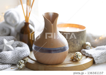 Still life with an aroma diffuser for moisturizing the air and winter decor. 136381137