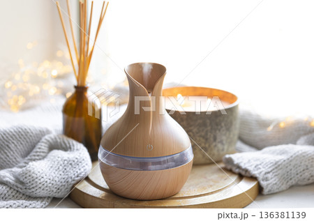 Still life with an aroma diffuser for moisturizing the air and winter decor. 136381139