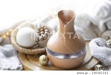 Still life with an aroma diffuser for moisturizing the air and winter decor. 136381141