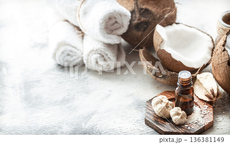 still life with coconut oil in a bottle and fresh coconut 136381149