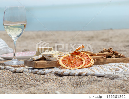 Summer beautiful romantic picnic by the sea close up. Summer beautiful romantic picnic by the sea close up. 136381262