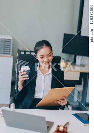 Lawyer explained to the client about the law that must be brought against the court case. Lawyer explained to the client about the law that must be brought against the court case. 136381609