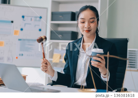 Lawyer explained to the client about the law that must be brought against the court case. Lawyer explained to the client about the law that must be brought against the court case. 136381618