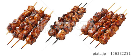 Grilled chicken yakitori skewer with teriyaki glaze or Isaw Filipino street food isolated on white transparent background Grilled chicken yakitori skewer with teriyaki glaze or Isaw Filipino street food isolated on white transparent background 136382251