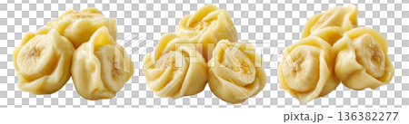Set of Steamed Banana dumplings with intricate twisted edges, isolated on white background. Concept of Asian cuisine and food art 136382277