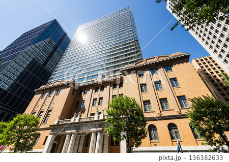 Low-angle view of the Mitsubishi UFJ Trust and Banking Museum, situated in the Marunouchi business and financial district, Chiyoda, Tokyo, Japan. Low-angle view of the Mitsubishi UFJ Trust and Banking Museum, situated in the Marunouchi business and financial district, Chiyoda, Tokyo, Japan. 136382633