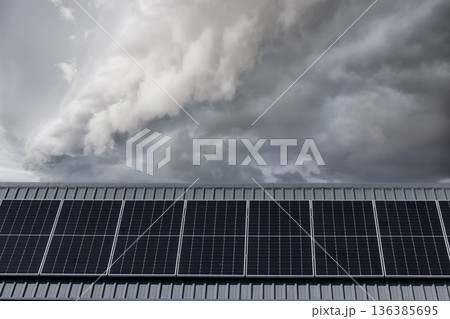Solar power panels on the roof for green energy.  136385695