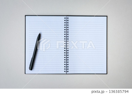 Open notepad with one pen. Open notepad with one pen. 136385794