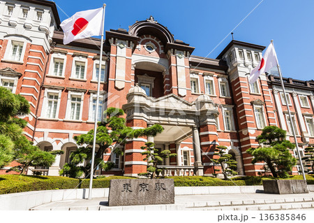 Building view of the Tokyo Station. It's a major inter-city rail terminal in Chiyoda, Tokyo, Japan. located in the Marunouchi business district.  136385846