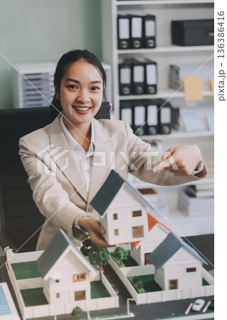 real estate agent home miniature model on documents sale and purchase of apartment notarial deed real estate agent home miniature model on documents sale and purchase of apartment notarial deed 136386416