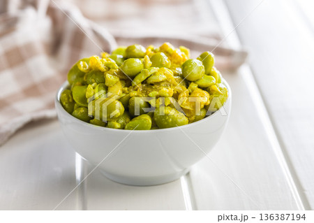 Fresh salad with edamame beans in bowl on white table. 136387194