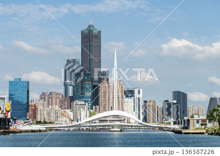 Panoramic view of the Dagang Bridge, 85 Sky Tower, and other buildings. The bridge connects Pier-2 Art Center and Peng-lai Commercial Harbor in Kaohsiung, Taiwan. Panoramic view of the Dagang Bridge, 85 Sky Tower, and other buildings. The bridge connects Pier-2 Art Center and Peng-lai Commercial Harbor in Kaohsiung, Taiwan. 136387226