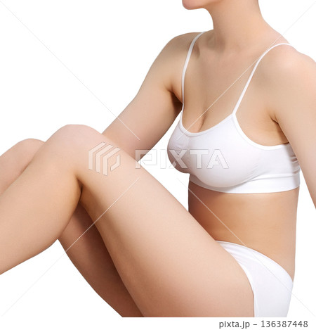 Beautiful slim young lady in white underwear. Studio shot. Isolated Beautiful slim young lady in white underwear. Studio shot. Isolated 136387448