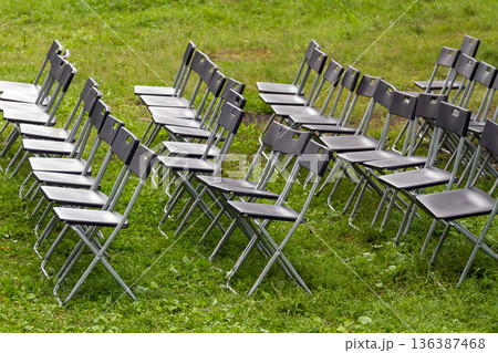 Wedding Chairs in a Row on the Green Grass. Wedding Chairs in a Row on the Green Grass. 136387468