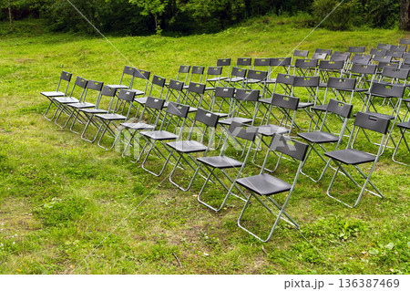 Wedding Chairs in a Row on the Green Grass 136387469