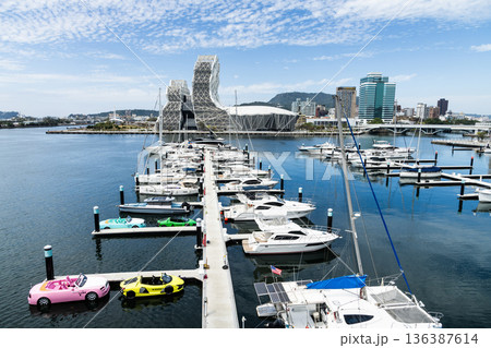 View of Argo Yacht Marina at Glory Pier of Kaohsiung Port, Taiwan, and the Kaohsiung Music Center building. View of Argo Yacht Marina at Glory Pier of Kaohsiung Port, Taiwan, and the Kaohsiung Music Center building. 136387614