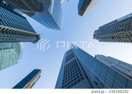Low-angle building view of the modern office skyscrapers in the financial district of Raffles Place, Singapore. 136388282
