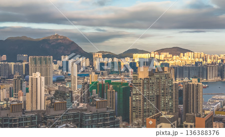 Feb 1 2026 Warm Evening Light Illuminates Hung Hom Skyline Beside Harbour 136388376