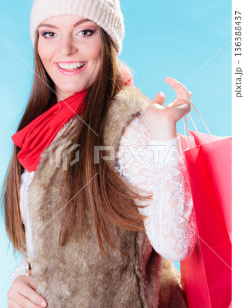 Winter woman with red paper shopping bag Winter woman with red paper shopping bag 136388437
