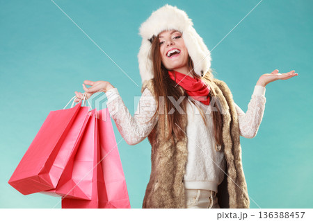 Woman with bags shopping. and empty hands. 136388457