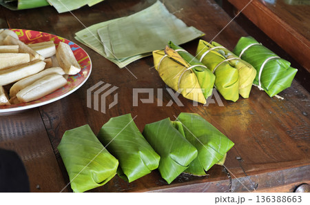 Khao Tom Mud before cooking,Traditional Thai dessert sticky rice, coconut milk and banana wrapped and black beans in banana leaves 136388663