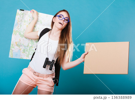 woman hitchhiking with blank sign for your text. 136388989
