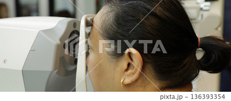 Phoropter for eye test, lenses glasses for eye check in optical store.  136393354