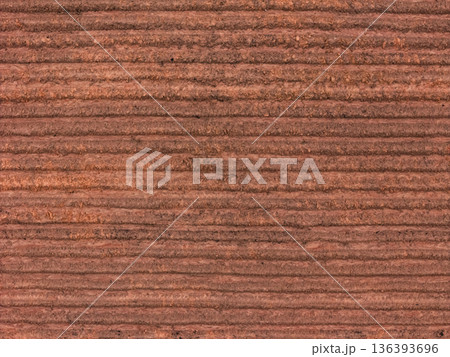 Aerial view ; Rows of soil before planting. Aerial view ; Rows of soil before planting. 136393696