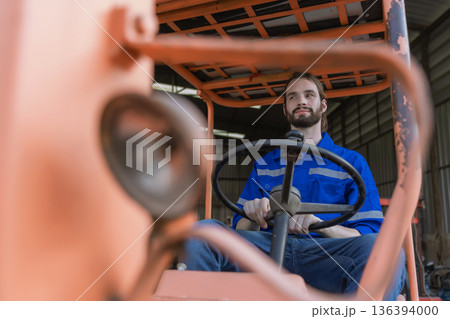 Man worker at forklift driver happy working in industry factory logistic ship. Man worker at forklift driver happy working in industry factory logistic ship. 136394000