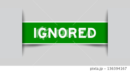 Green color square shape sticker label with word ignored inserted in gray background 136394167