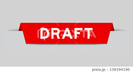 Red color inserted label with word draft on gray background Red color inserted label with word draft on gray background 136394190