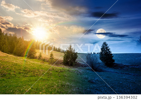 rolling hill with green field under cloudy sky in spring. day and night time change concept. scenic view countryside landscape in mountains with sun and moon at twilight. equality and shift template rolling hill with green field under cloudy sky in spring. day and night time change concept. scenic view countryside landscape in mountains with sun and moon at twilight. equality and shift template 136394302