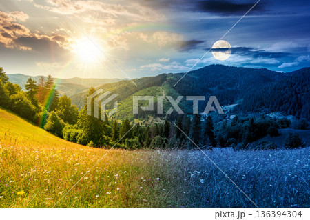 grassy pastoral field near forested hills during summer solstice. day and night time change concept. countryside mountain landscape with sun and moon. rolling scenery with distant ridges grassy pastoral field near forested hills during summer solstice. day and night time change concept. countryside mountain landscape with sun and moon. rolling scenery with distant ridges 136394304