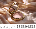 Gold compact mirror with pink blush on silk fabric. Decorative cosmetics accessories, luxury beauty lifestyle. Fashion concepts, elegant cosmetic, beauty woman, professional makeup artistry. 136394838