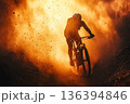 Professional cyclist performing on mountain trail with dust and sunlight. Extreme faceless mountain biker riding through. Sport, adventure lifestyle, energy, endurance, freedom, nature outdoor fitness 136394846