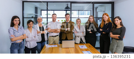 Diverse colleagues gather in brainstorm discuss statistics together. Diverse colleagues gather in brainstorm discuss statistics together. 136395231