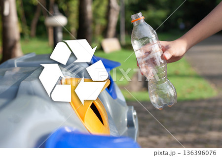 Close up of person recycling plastic bottle with recycle symbol overlay, eco-friendly lifestyle concept. Close up of person recycling plastic bottle with recycle symbol overlay, eco-friendly lifestyle concept. 136396076