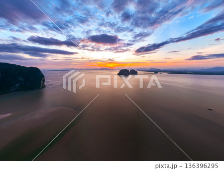 Aerial view sunset sky,Nature beautiful Light Sunset or sunrise over sea,Colorful scenery sunset Panorama Sky with Amazing clouds and waves in the ocean golden light cloud background 136396295