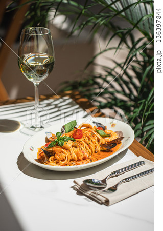 Seafood pasta with tomatoes and white wine Seafood pasta with tomatoes and white wine 136397844
