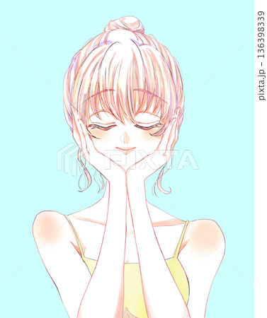 お団子頭の女性　目を閉じる　顔に手　キャミソール 136398339