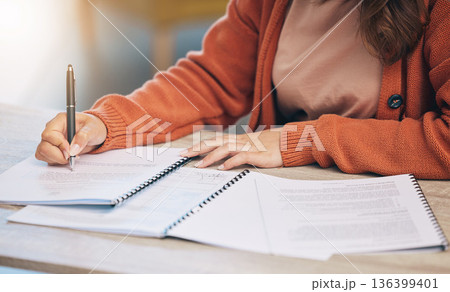 Woman, hands and writing on documents for signing contract, form or application on desk at home. Closeup of female person working on paperwork, notes or filling in survey for legal agreement or deal Woman, hands and writing on documents for signing contract, form or application on desk at home. Closeup of female person working on paperwork, notes or filling in survey for legal agreement or deal 136399401