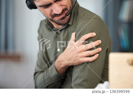 Call center man, shoulder pain and muscle in office, communication expert or consultant with burnout. Young telemarketing agent, crm and stress injury with accident, problem or fatigue in workplace Call center man, shoulder pain and muscle in office, communication expert or consultant with burnout. Young telemarketing agent, crm and stress injury with accident, problem or fatigue in workplace 136399599