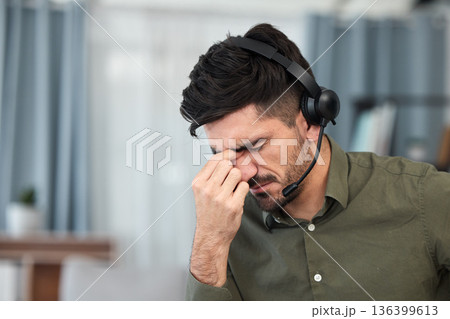 Telemarketing, tech support and man with a headache, burnout and overtime with stress, pain and tension. Male person, employee and consultant with a migraine, health problem and agent with fatigue 136399613