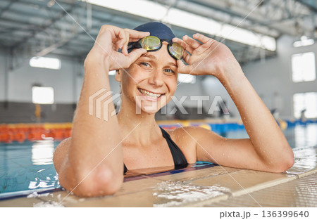 Swimming pool, portrait and woman smile with goggles in water for exercise, workout or sport. Face, swim athlete and person happy for fitness, training or wellness, health and confidence in Australia 136399640