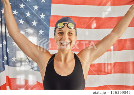 Woman, sport and flag for USA in portrait for winning, goals and pride for swimming games. Girl, swimmer or athlete with smile on face for contest, race or happy for fitness, health or United States Woman, sport and flag for USA in portrait for winning, goals and pride for swimming games. Girl, swimmer or athlete with smile on face for contest, race or happy for fitness, health or United States 136399843