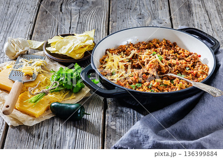 Texas hash of beef pepper onion tomato and rice 136399884