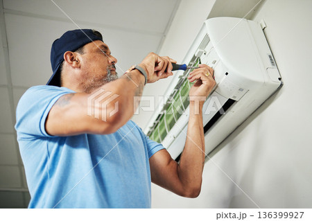 Electrician, ac repair and air conditioning with man and screwdriver for maintenance, ventilation and power. Engineering, electricity and inspection with technician and tools for fan and contractor 136399927